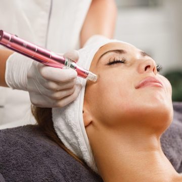 Shot of a beautiful young woman on a facial dermapen micro-needling treatment at the beauty salon.